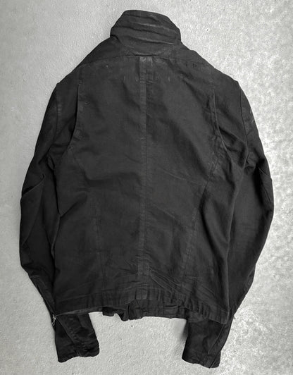 Black jacket on a textured gray surface