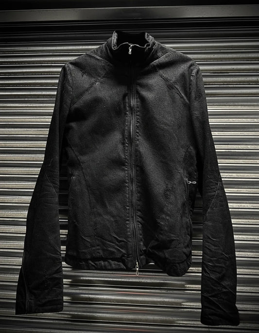 Black jacket on a metallic surface