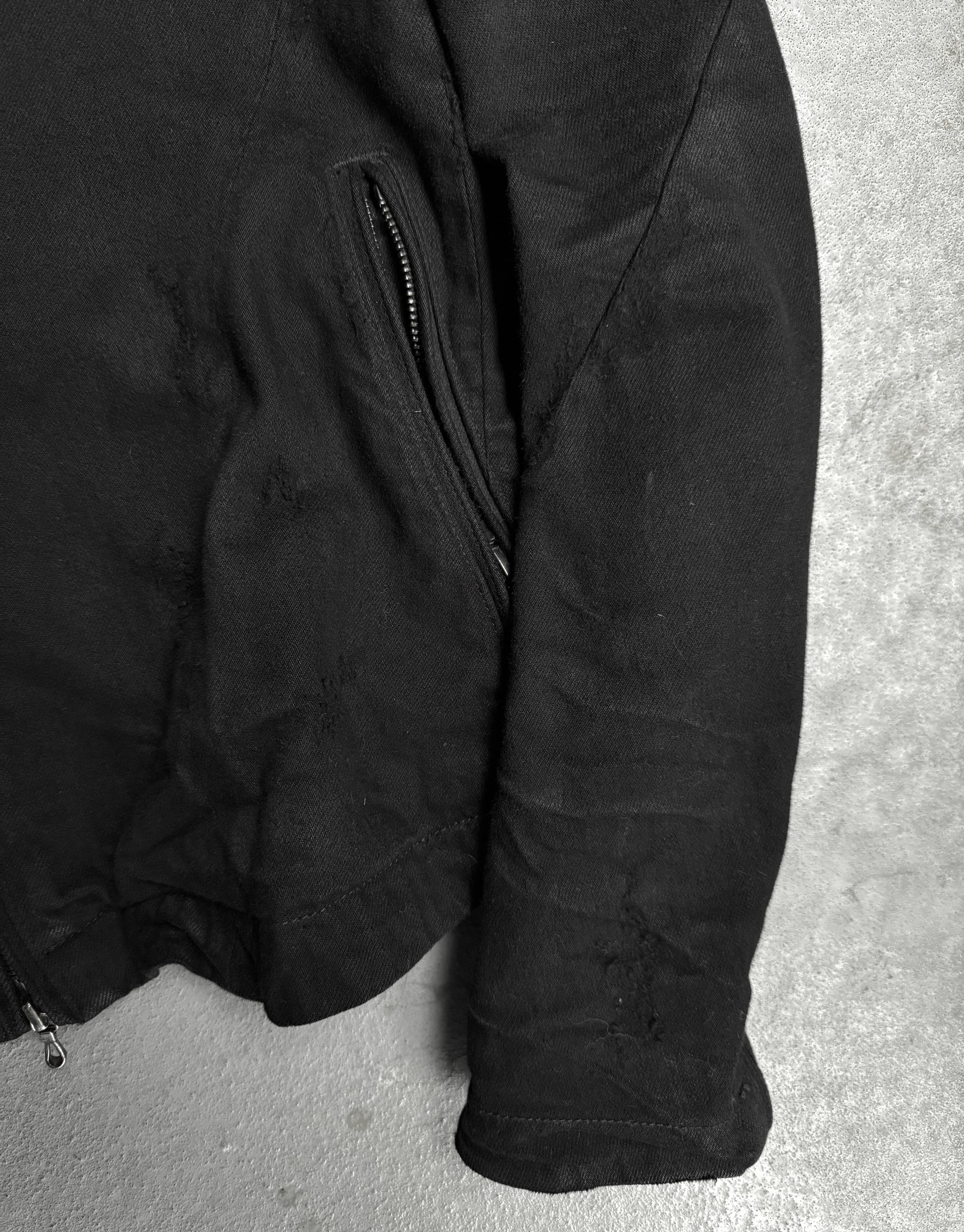 Black jacket on a gray surface