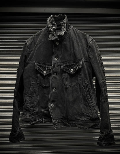 Dark denim jacket with frayed collar on a metallic background