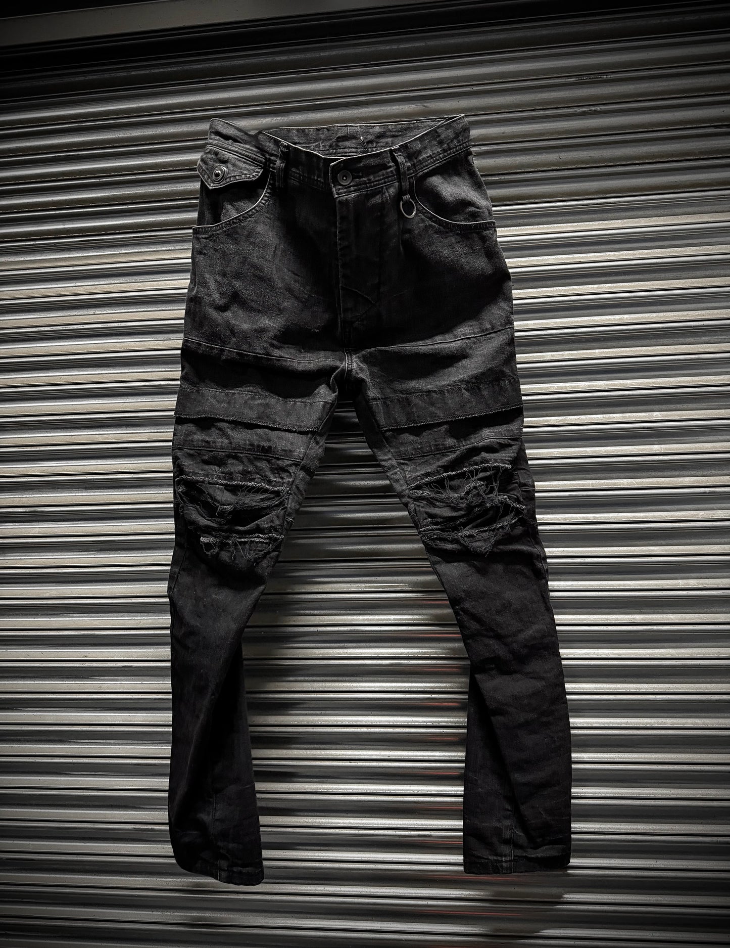 Julius_7 SS22 "_PERMANENT" Washed Black Distressed J-Cut Denim