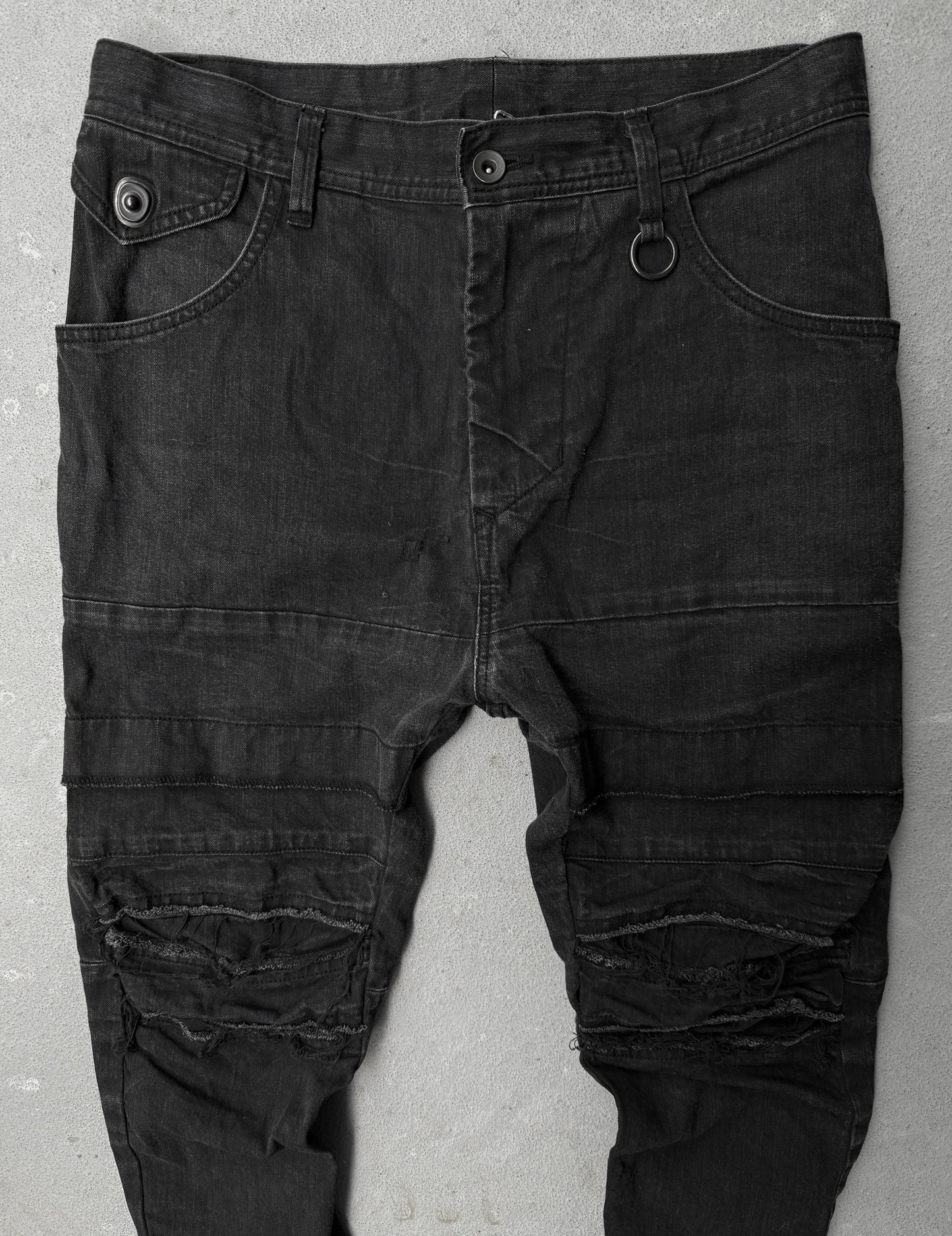 Julius_7 SS22 "_PERMANENT" Washed Black Distressed J-Cut Denim