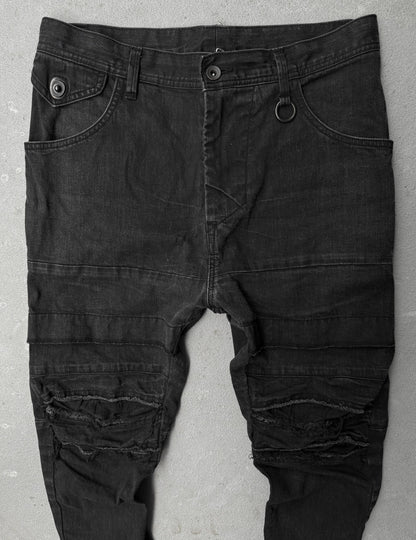 Julius_7 SS22 "_PERMANENT" Washed Black Distressed J-Cut Denim