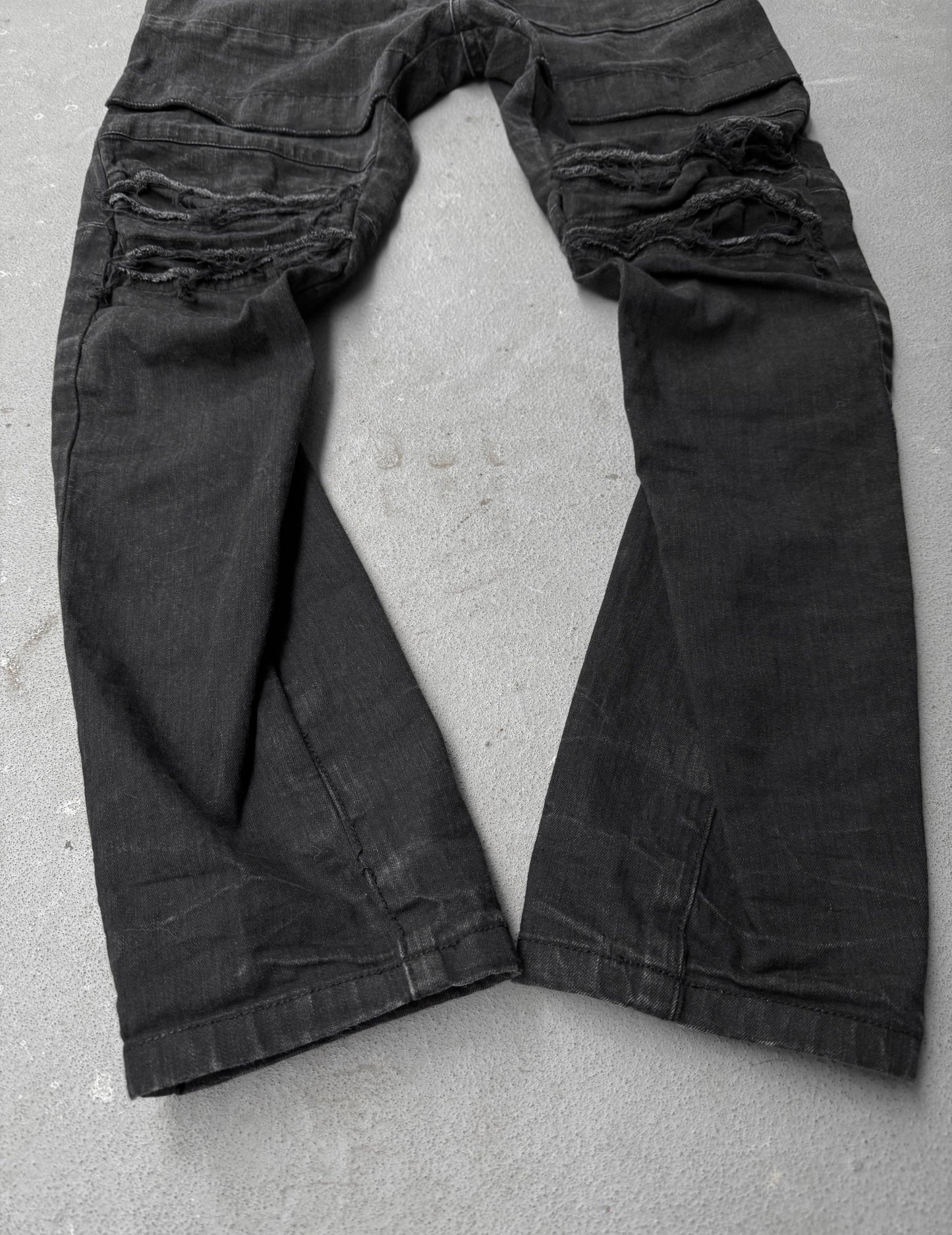 Julius_7 SS22 "_PERMANENT" Washed Black Distressed J-Cut Denim