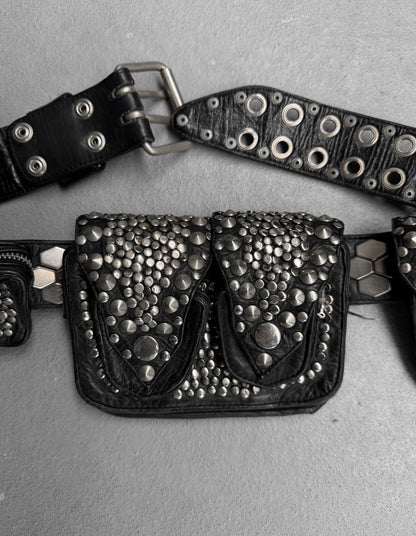 Black studded belt bag on a gray background