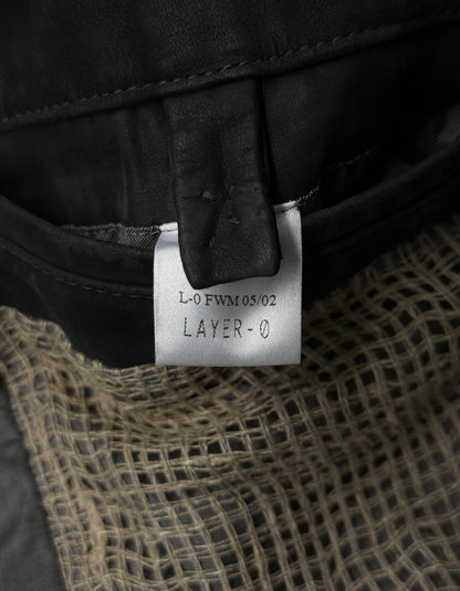 Close-up of a label on a piece of clothing with text and design details.