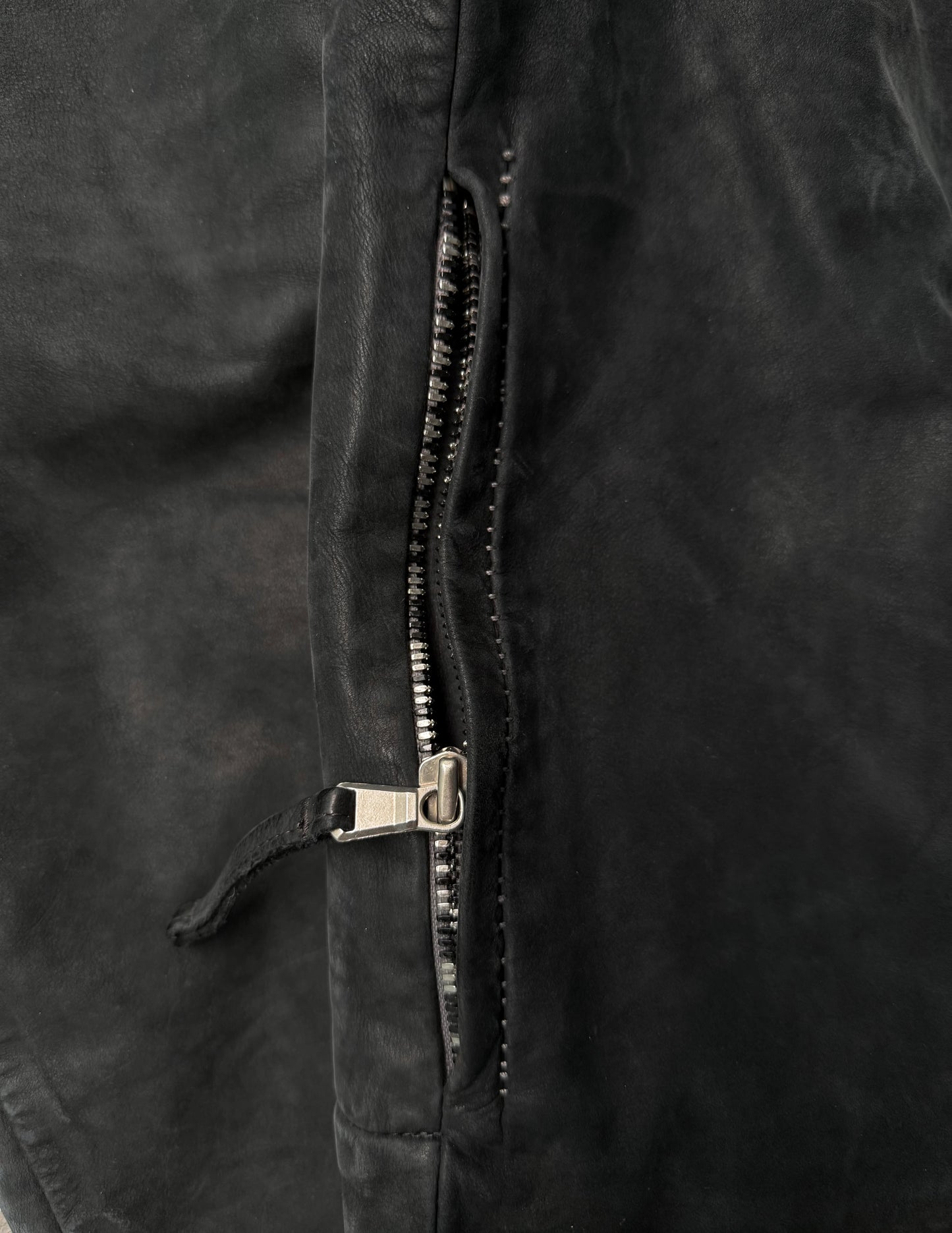 Close-up of a zipper on a black jacket