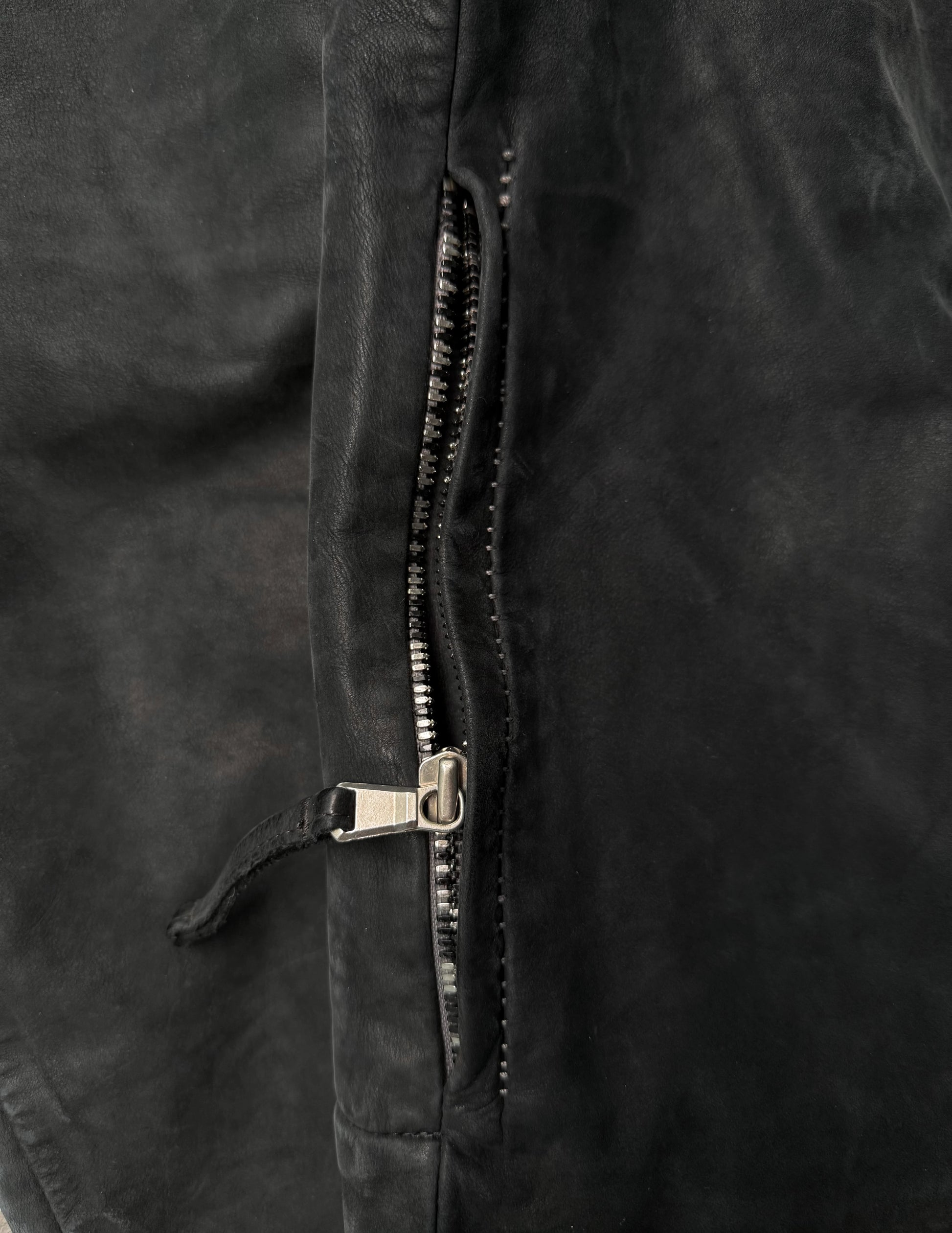 Close-up of a zipper on a black jacket