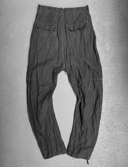 Dark gray pants on a flat surface