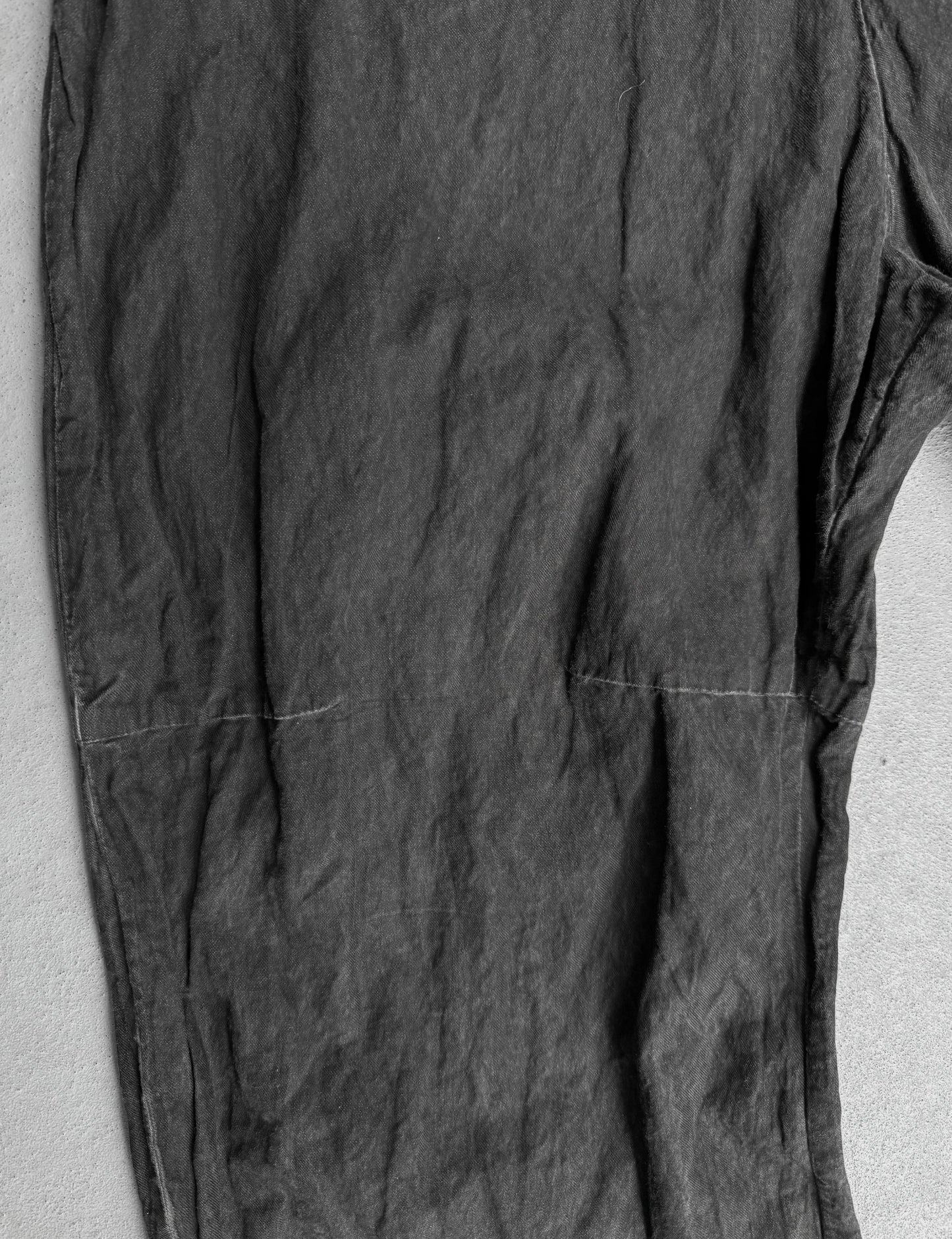 Dark gray pants on a light gray background