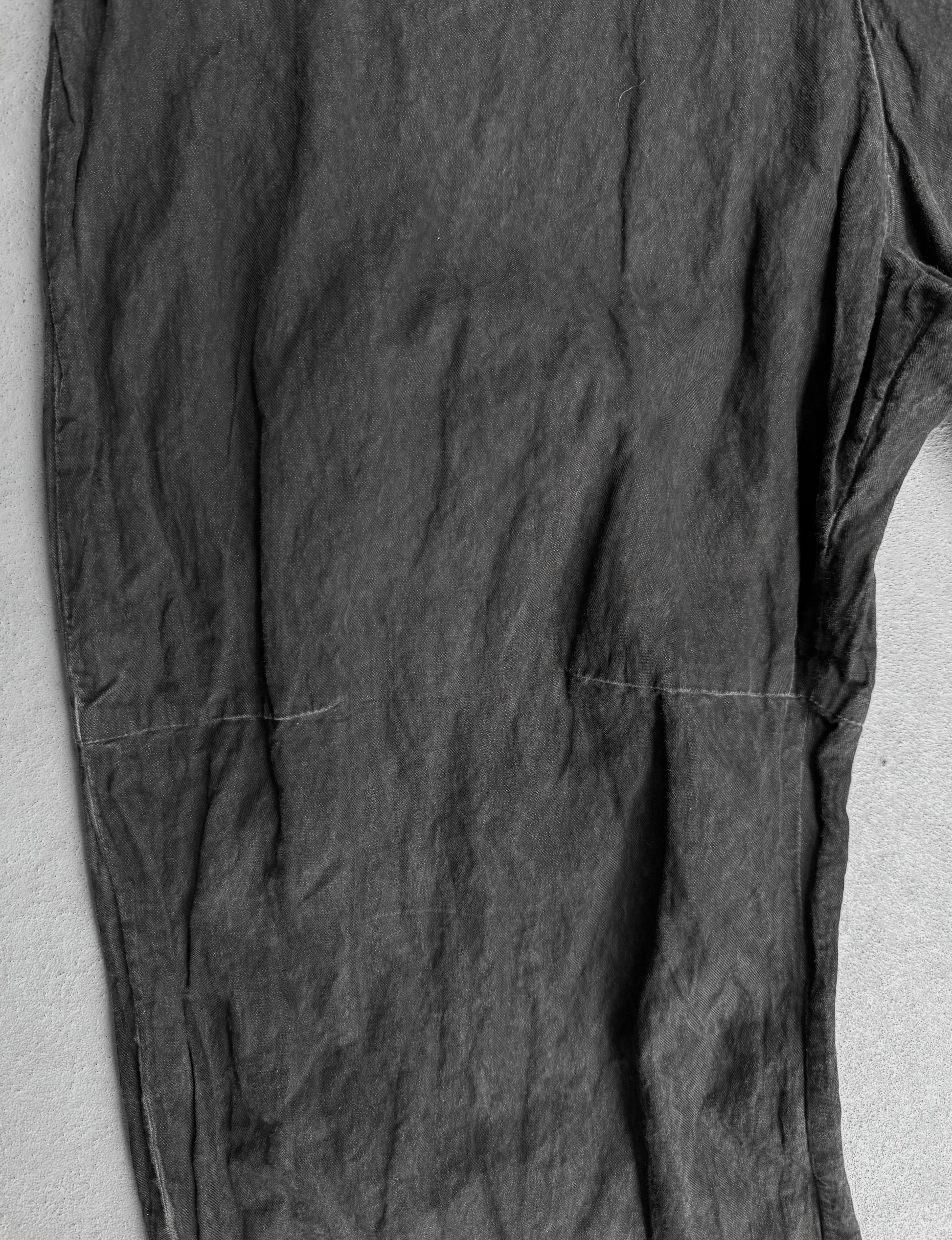 Dark gray pants on a light gray background