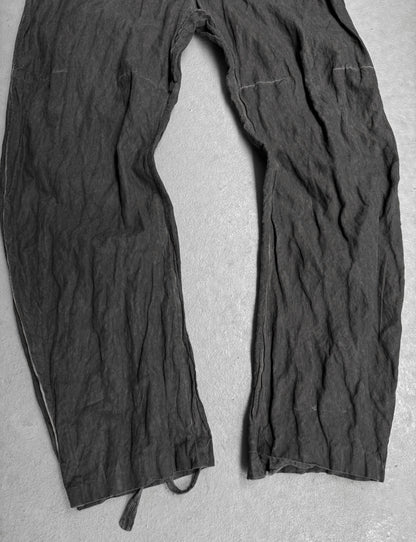 Dark gray pants on a light gray background