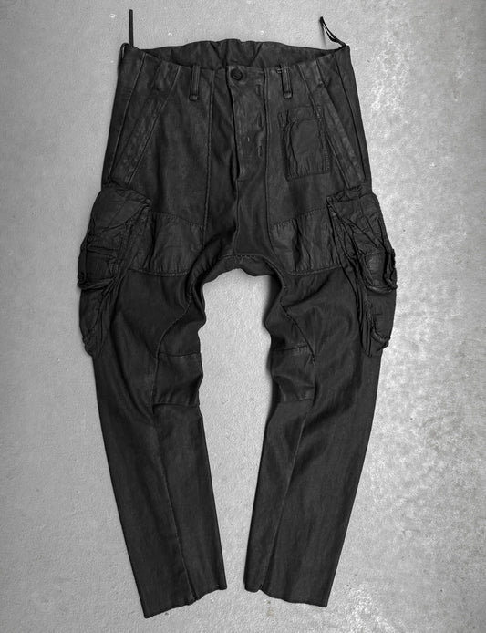 Black cargo pants on a gray textured background