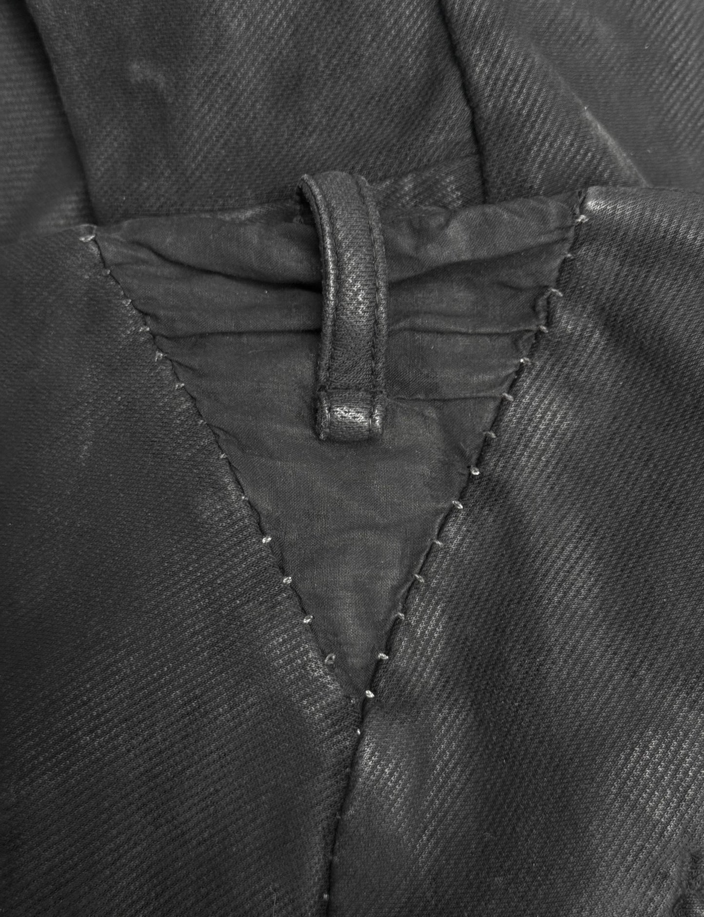 Close-up of a black jacket with stitching detail