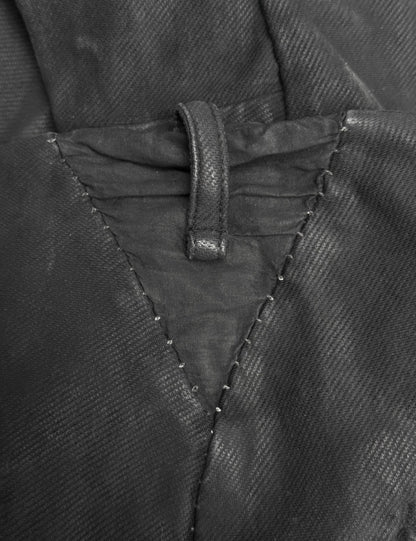 Close-up of a black jacket with stitching detail