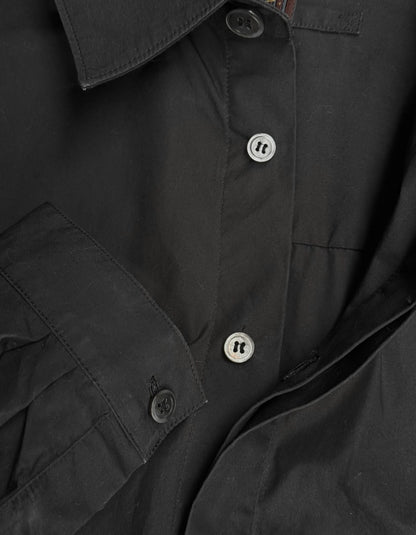 Close-up of a dark jacket with button details