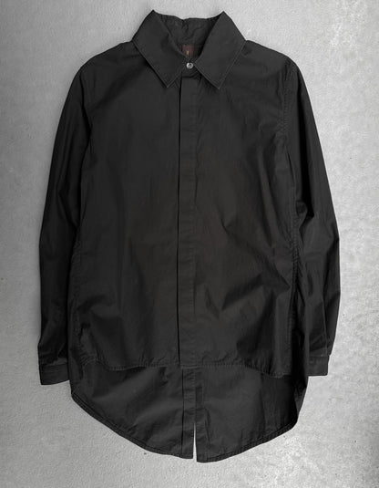 Black shirt on a textured gray background