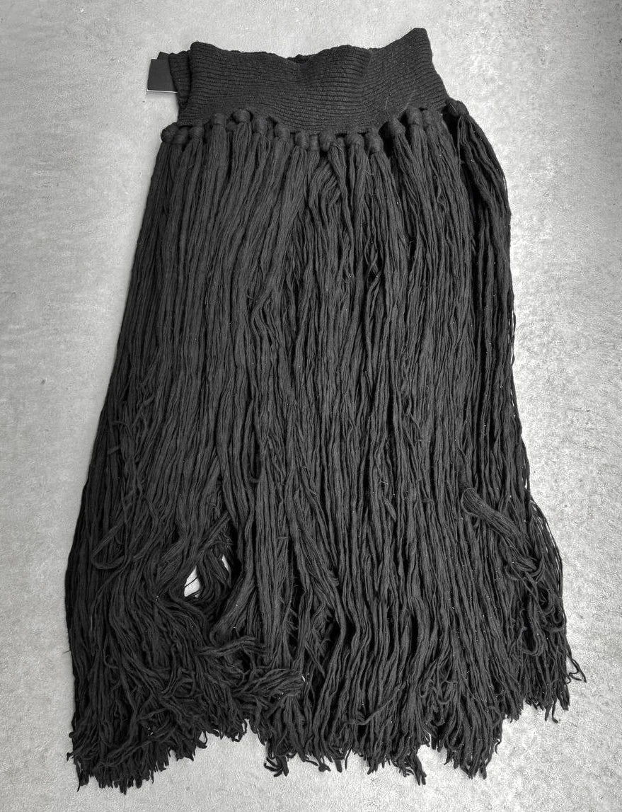 Black fringed garment on a gray background