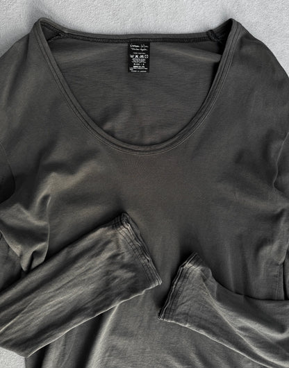 Dark gray long-sleeve shirt with a tag on a light gray background