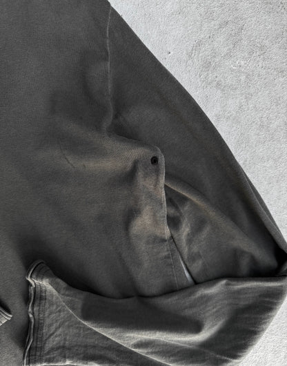 Close-up of a dark gray jacket on a light gray background