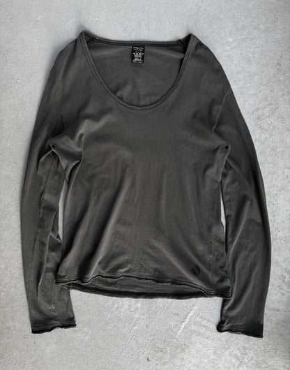Dark gray long-sleeve shirt on a textured gray surface
