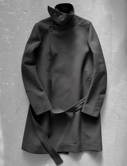 Black coat on a textured gray background