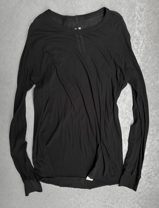 Black long-sleeve shirt on a gray surface