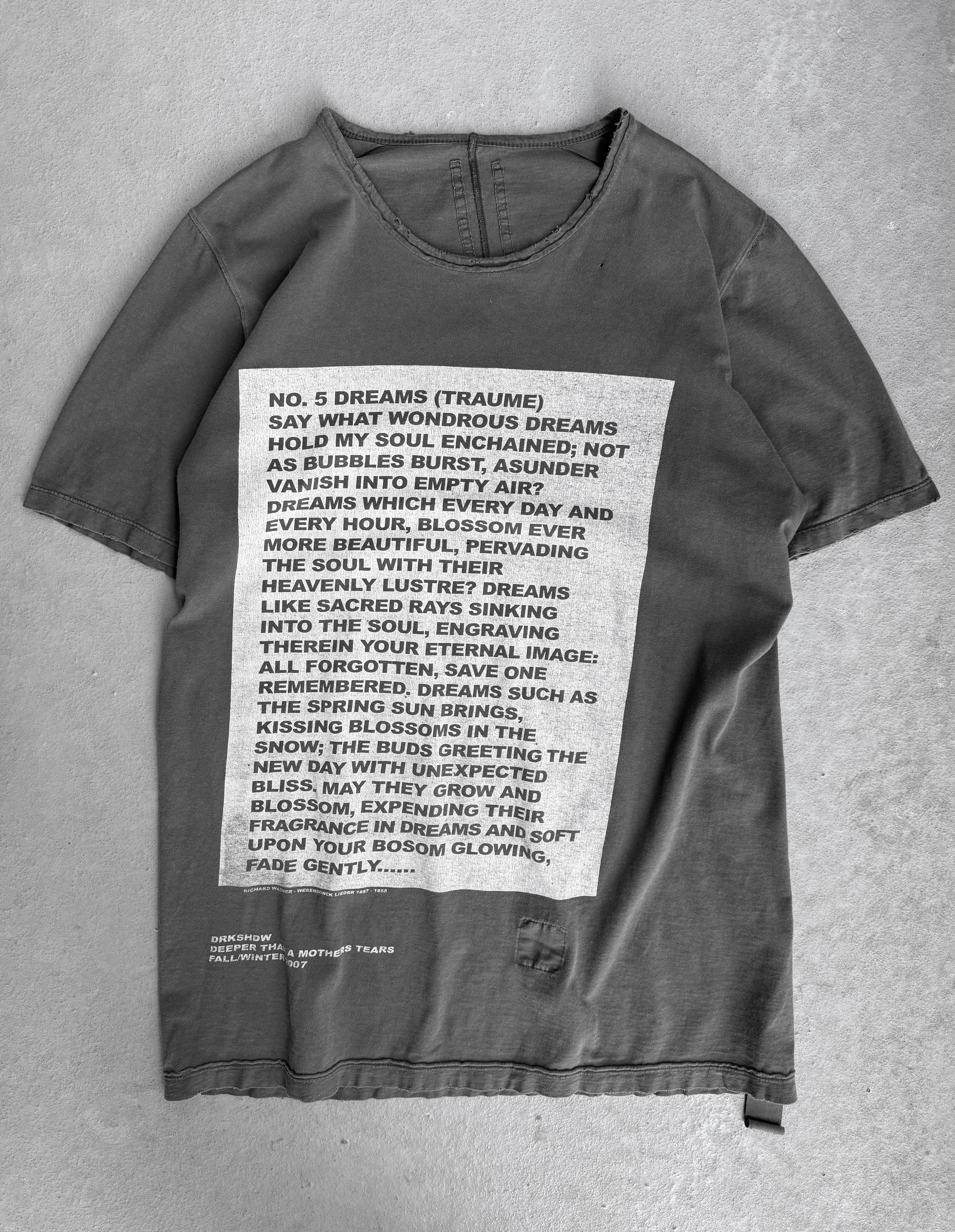 Gray t-shirt with printed text on a gray background