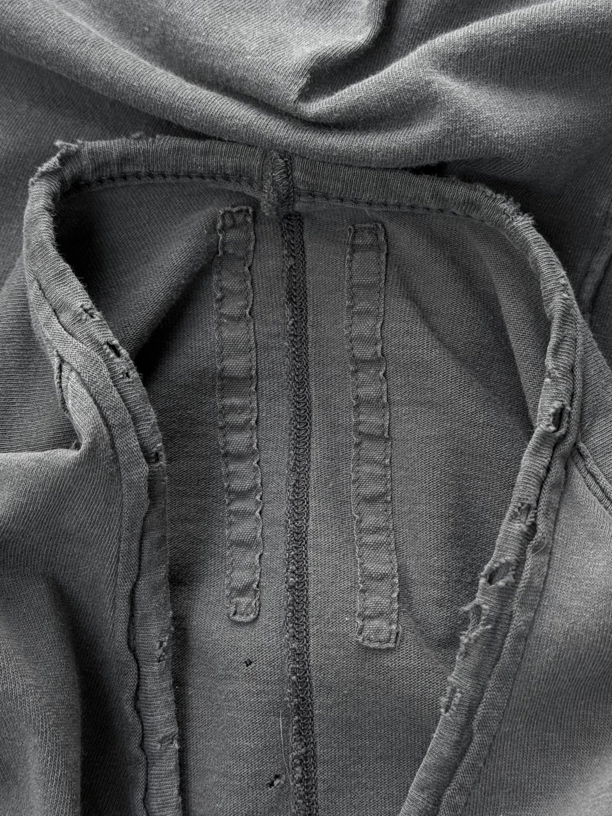 Close-up of a textured fabric surface with stitching details