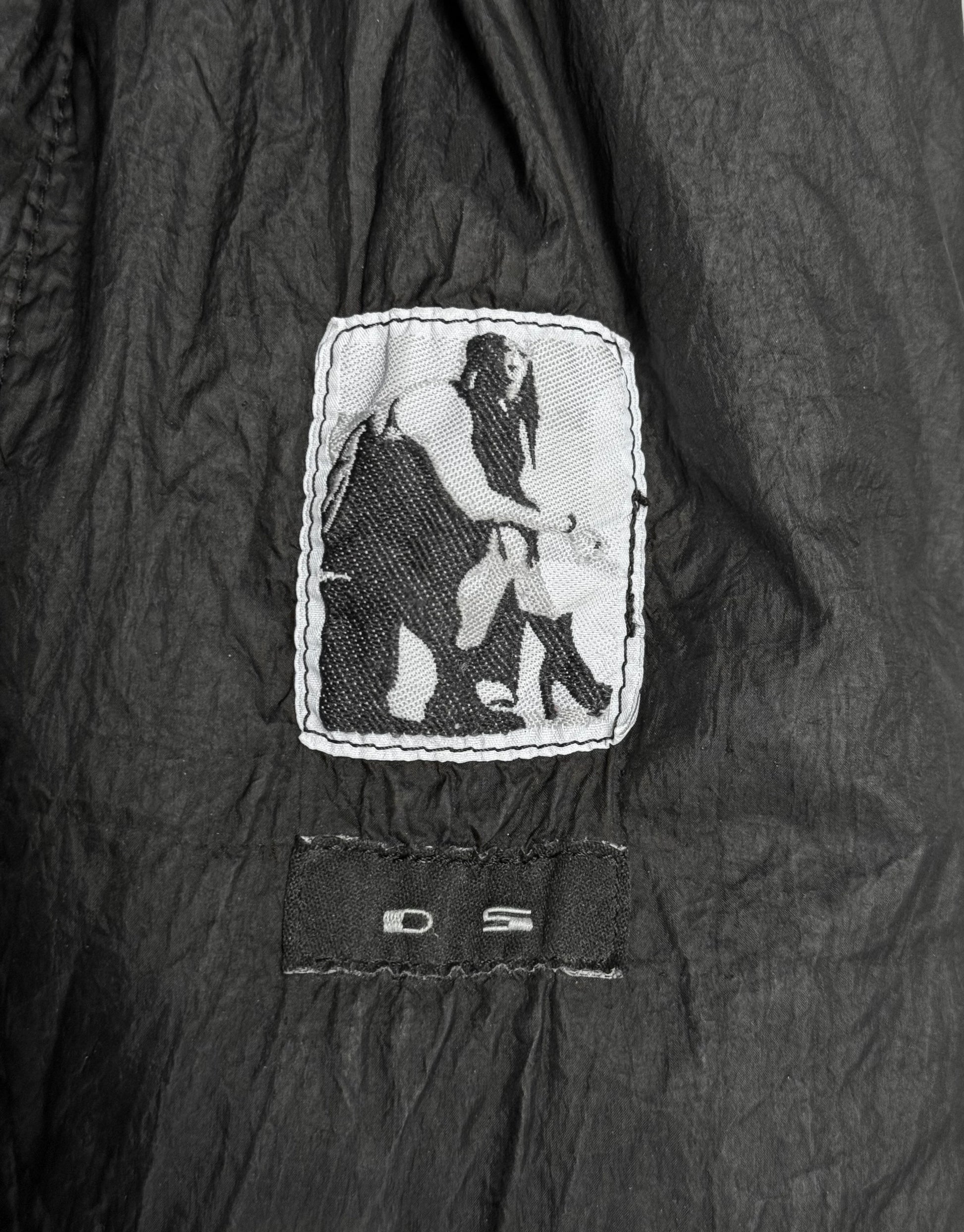 Black jacket with a white logo on a dark background