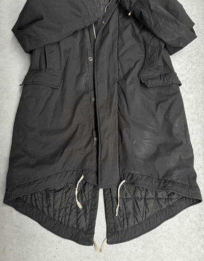 Black jacket with quilted design on a light gray background