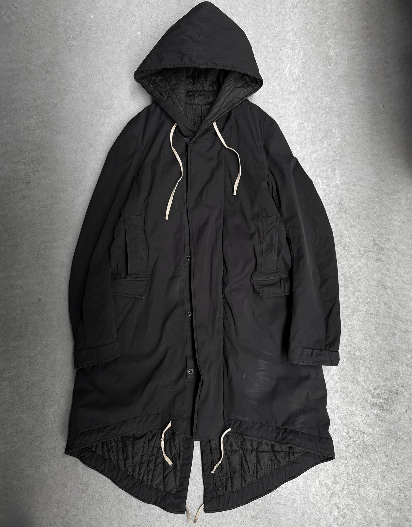 Black hooded coat on a gray background