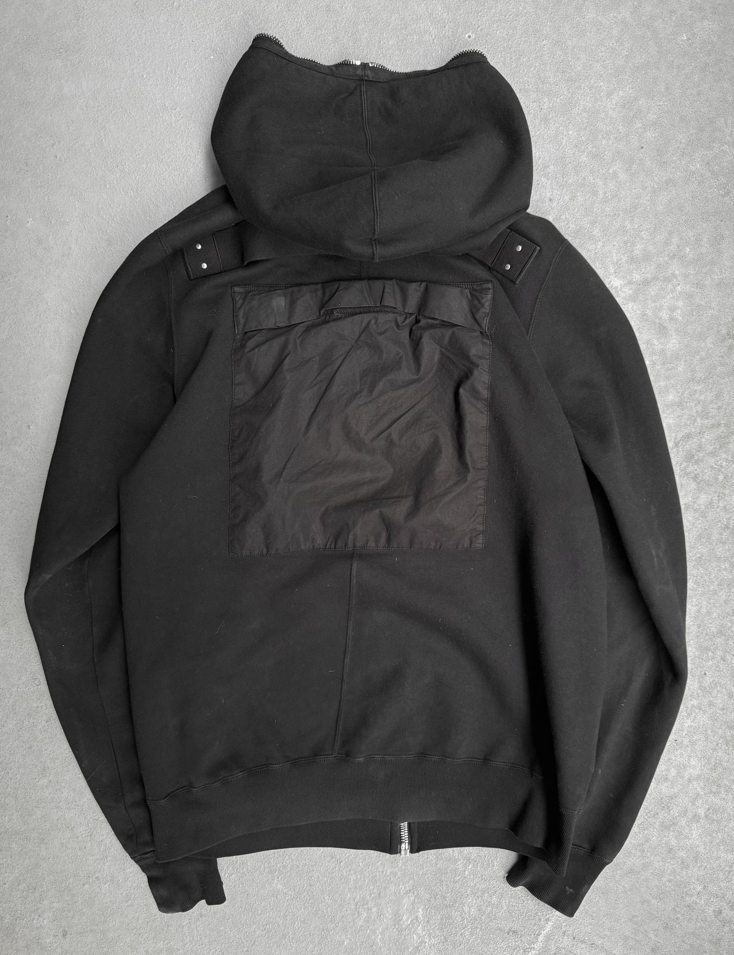 Black jacket with a hood on a gray background