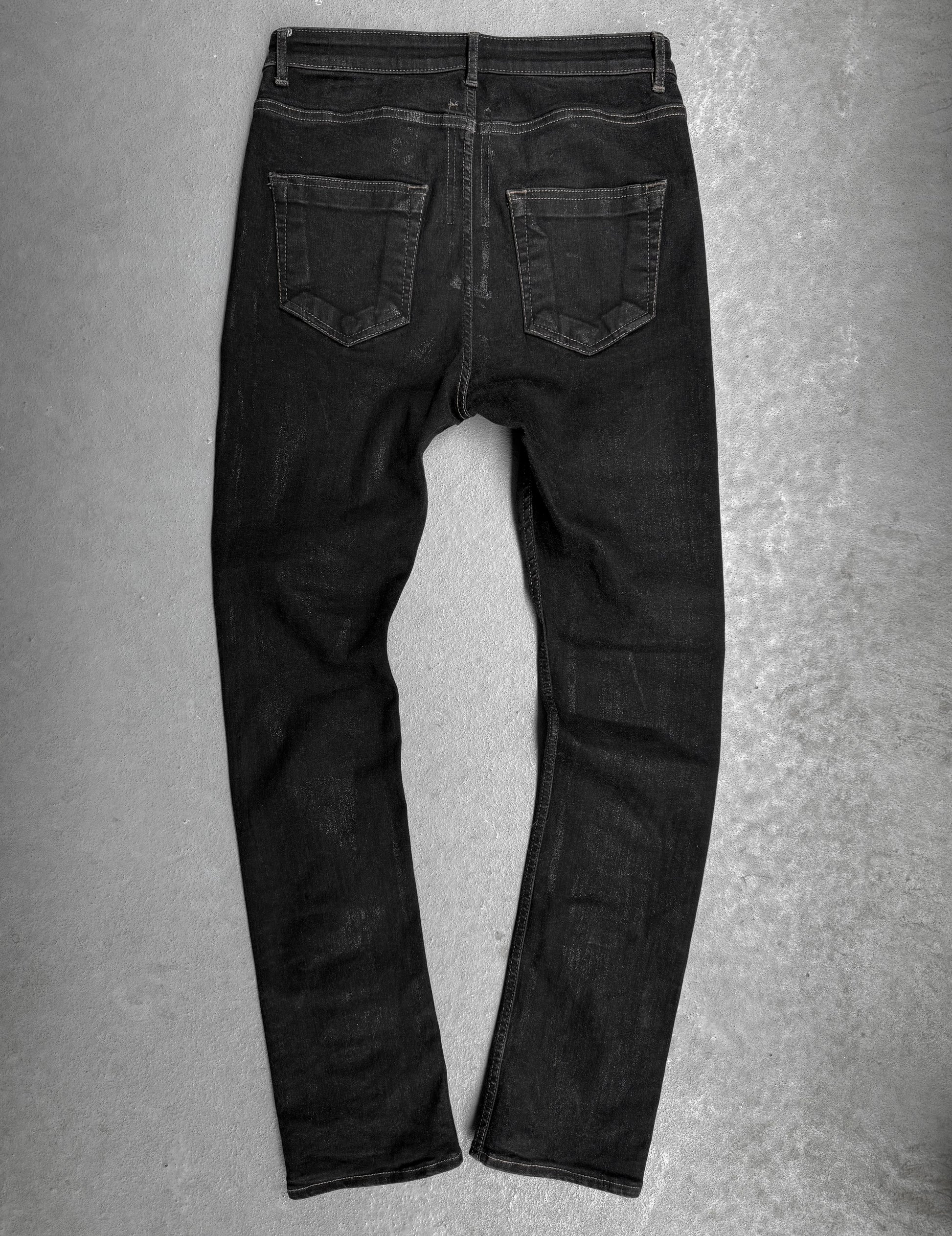 Black jeans on a gray background