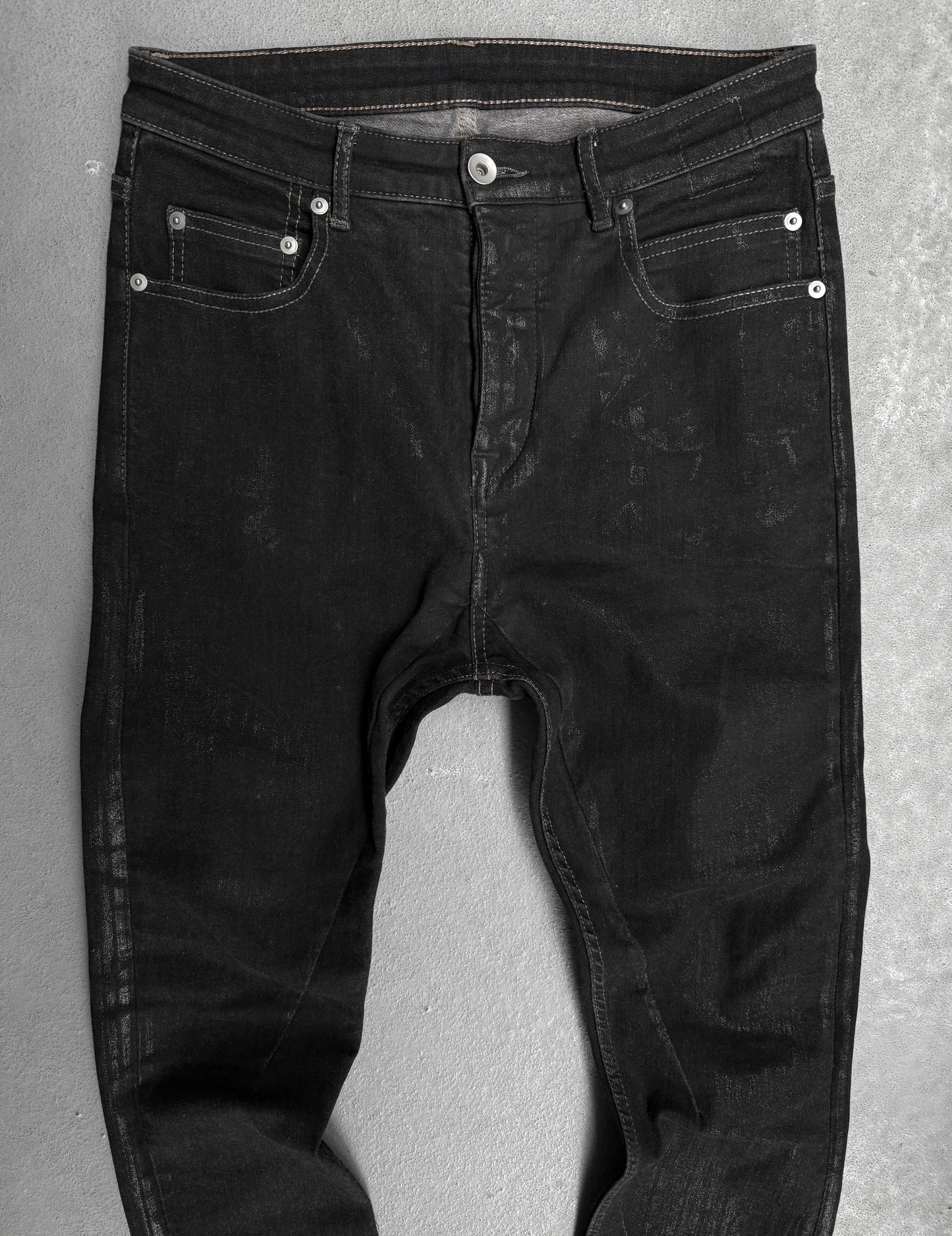 Black jeans on a gray background