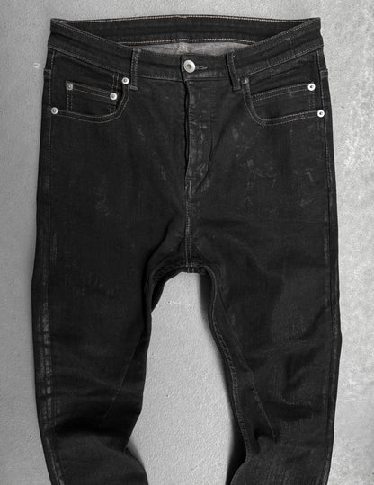Black jeans on a gray background