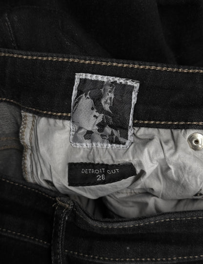 Close-up of a label on a jacket with a black and white photo and text.