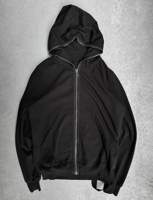 Black hoodie with a zipper on a gray background