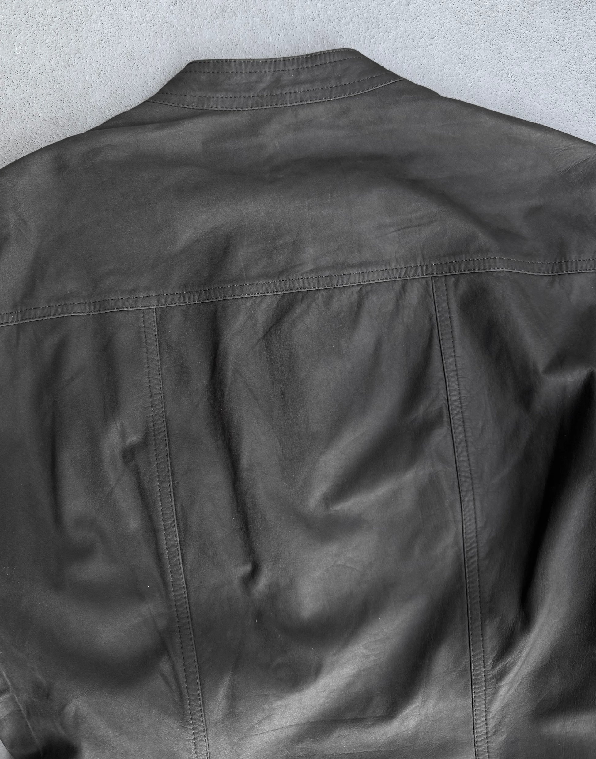 Black leather jacket on a light gray background