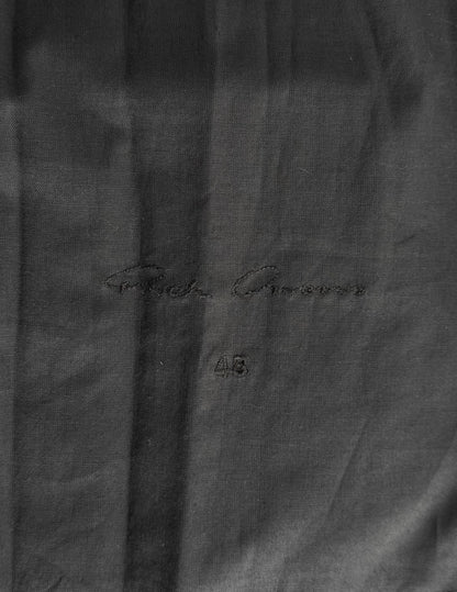 Close-up of a dark gray suit jacket with 'Forte' branding and size label.