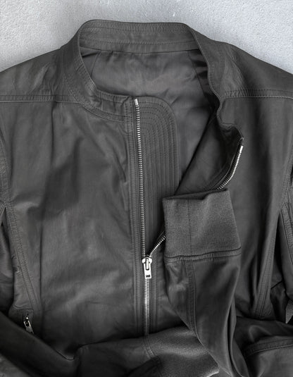 Close-up of a black jacket with zippers on a gray background
