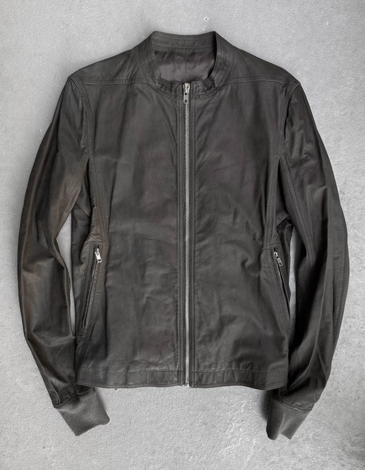 Black leather jacket on a gray background