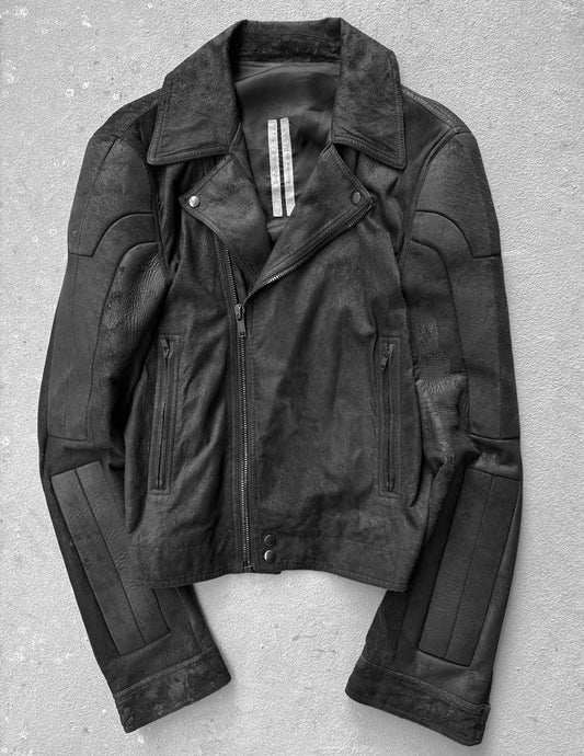 Black leather jacket on a gray background