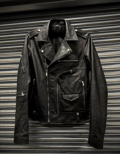 Black leather jacket on a metallic surface