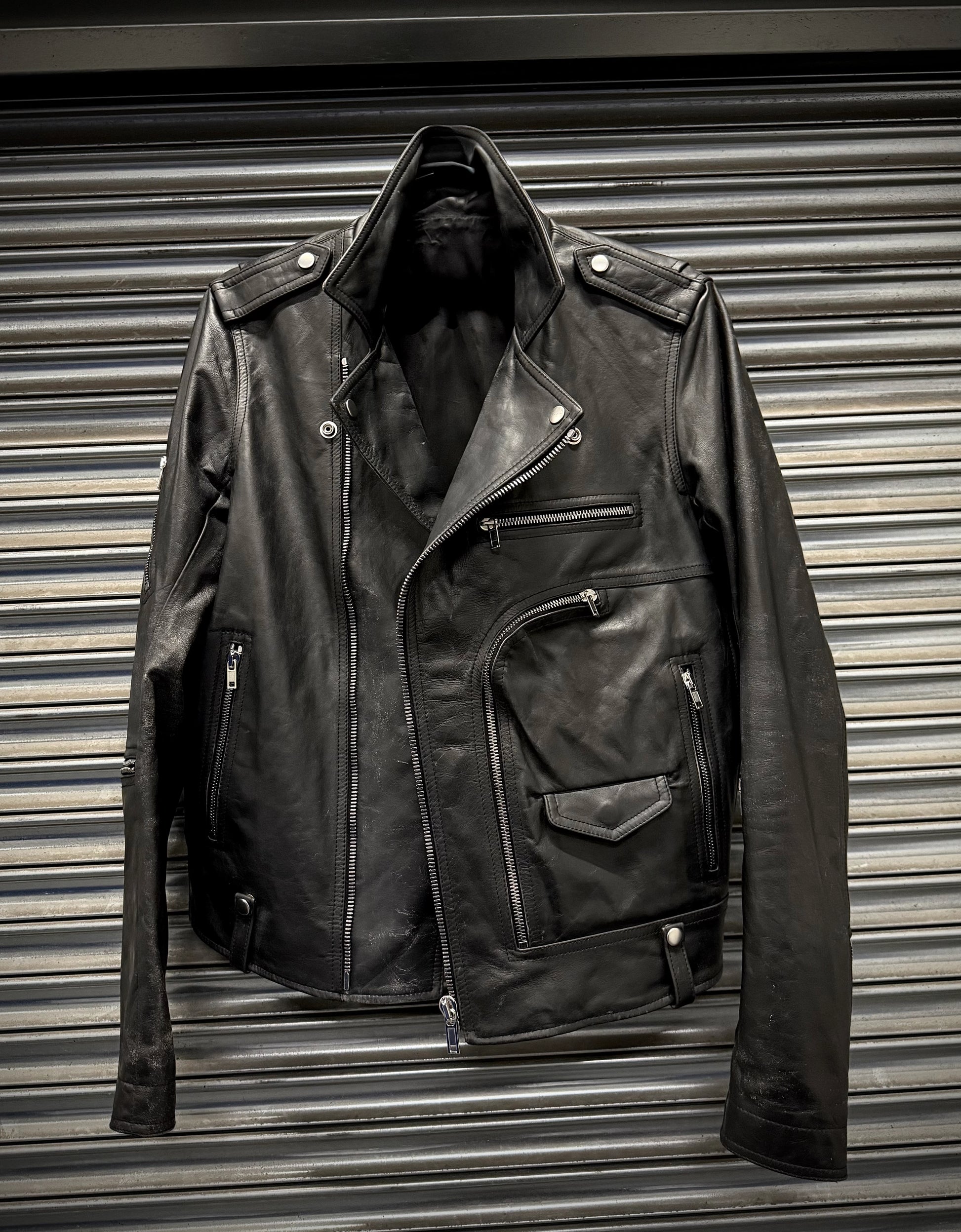 Black leather jacket on a metallic surface