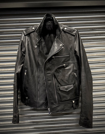 Black leather jacket on a metallic surface
