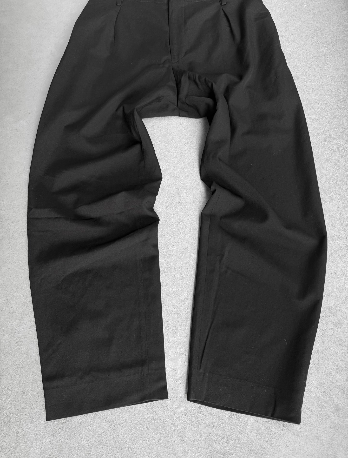 Black pants on a light gray background