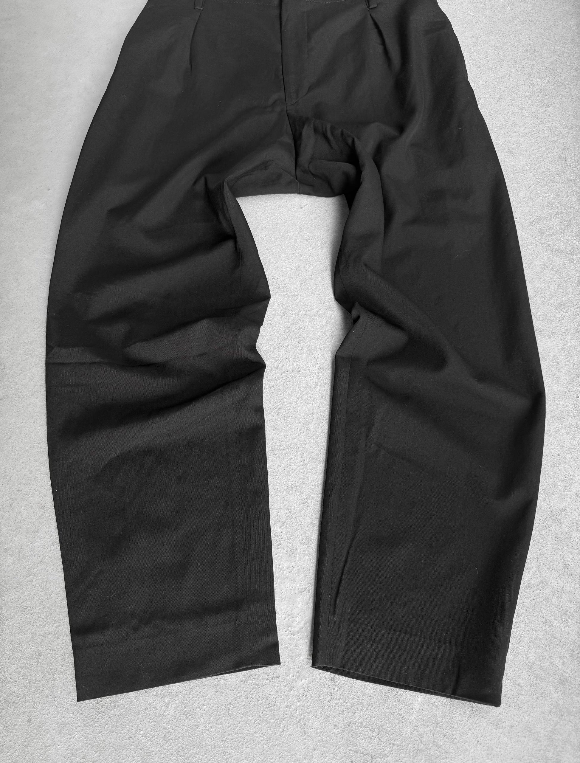 Black pants on a light gray background