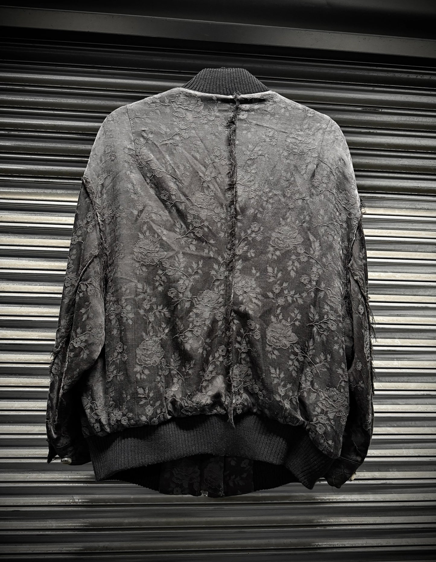 Vintage camouflage jacket on a metallic surface