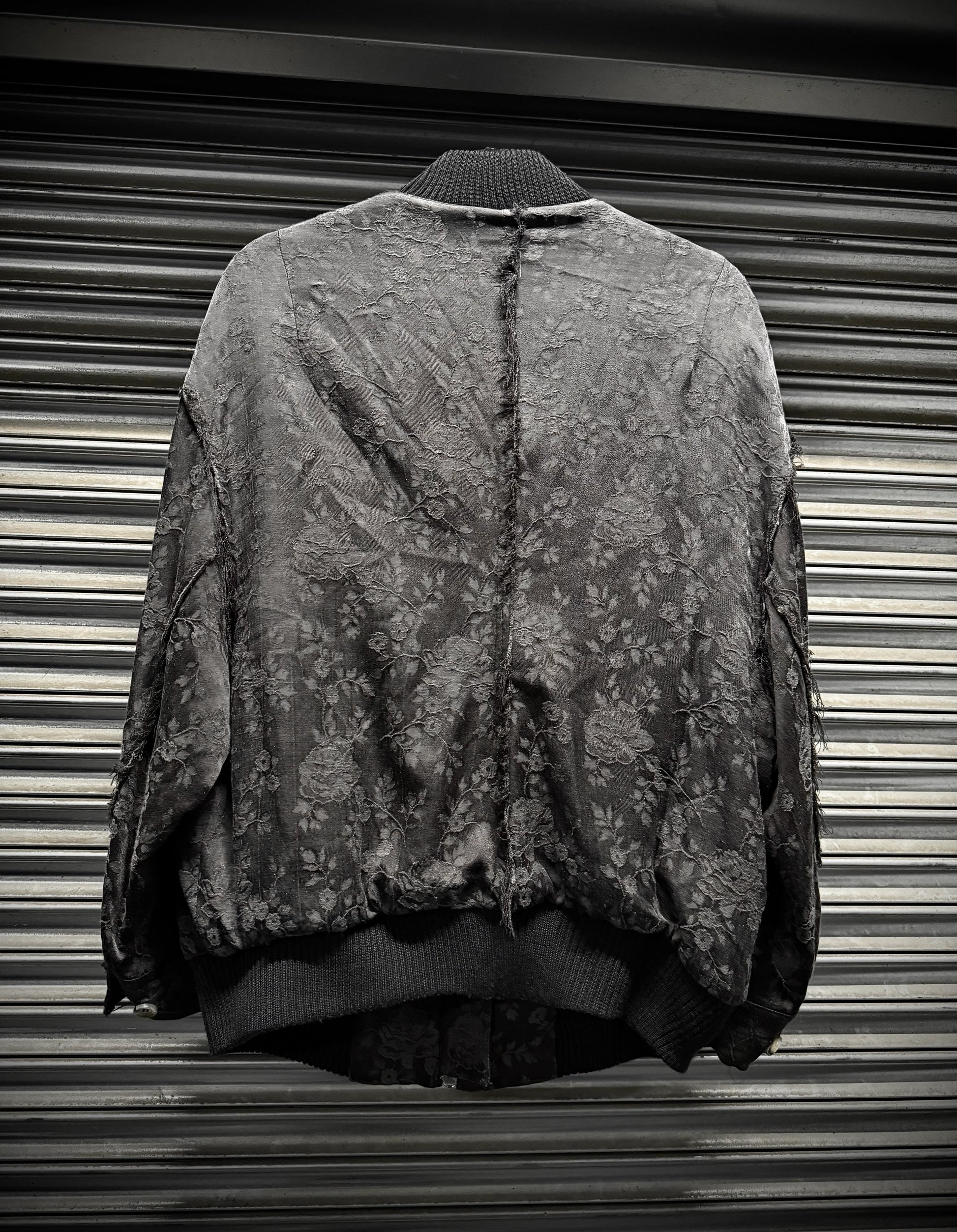 Vintage camouflage jacket on a metallic surface
